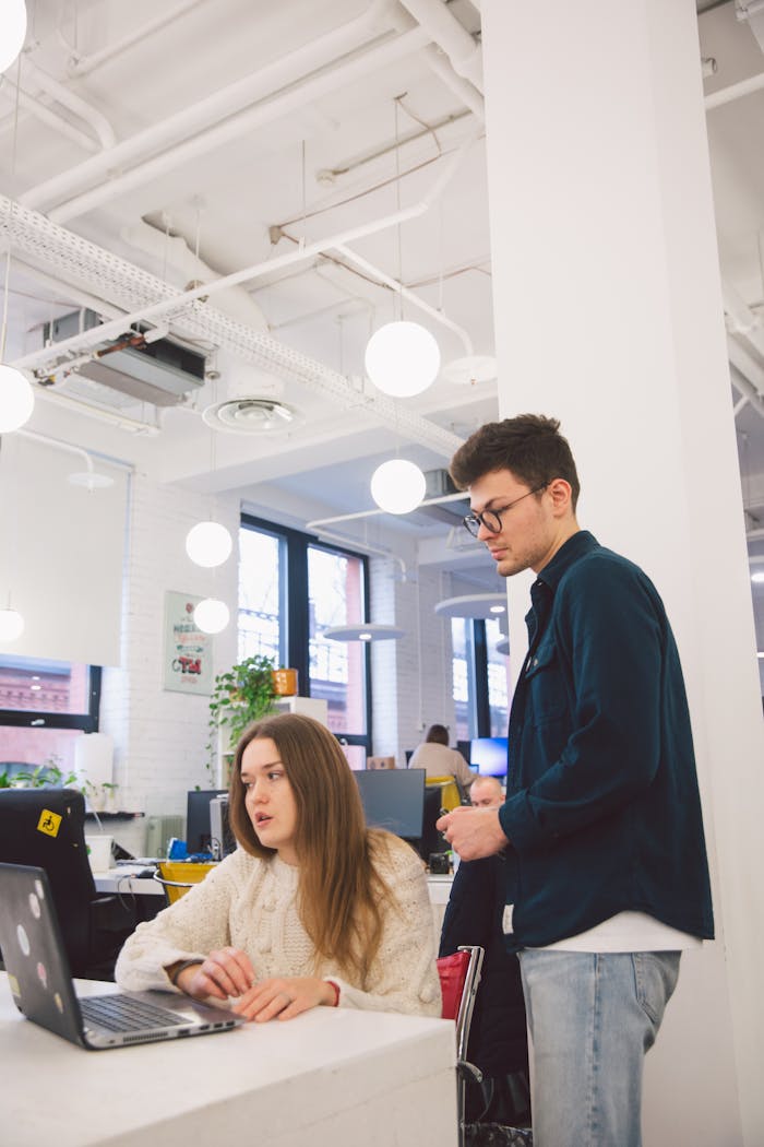 Young professionals collaborating in a bright modern office setting.